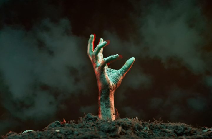 Image of zombie hand sticking out of grave.
